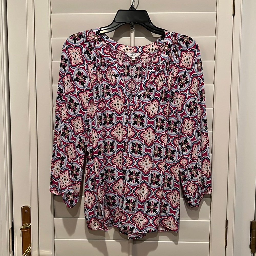 A flowing fit and colorful medallion print lend charming versatility to this…